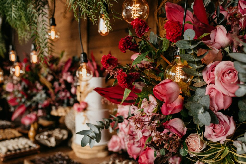 pink roses beside gold and white baubles